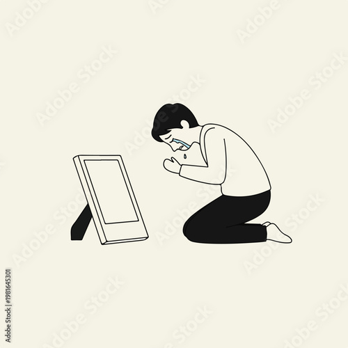 A man kneels and cries while facing an empty picture frame on the floor