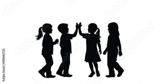 Four children giving each other a high five in silhouette