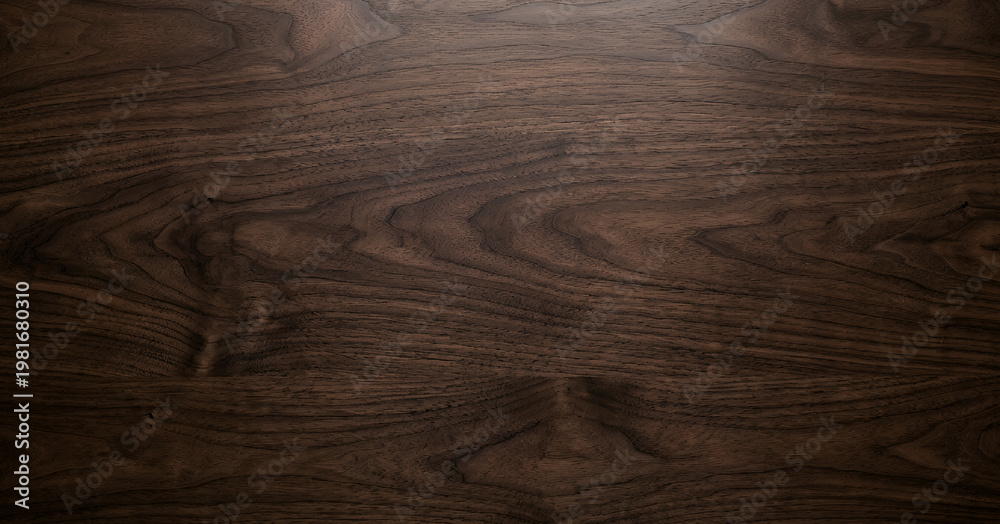 Close-up of dark walnut wood surface showcasing natural grain patterns and textures, ideal for backgrounds and design projects highlighting natural materials.
