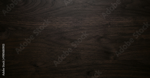 Tableau sur toile A close-up view of a dark wooden surface, showcasing intricate grain patterns and textures