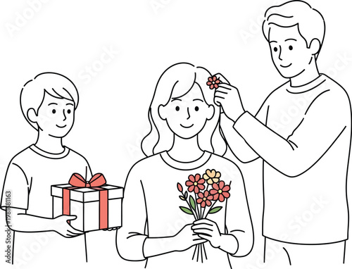 Young boy presenting a gift while father places a flower in the hair of a smiling woman during celebration