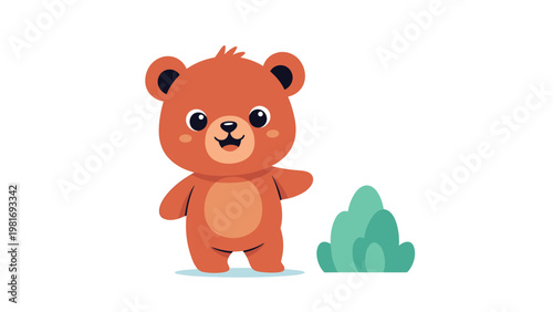 Cute brown bear cub with large ears and a friendly smile stands in a field next to a green bush on a bright sunny day.