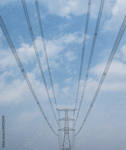 Wallpaper Mural High-Voltage Transmission Tower with Radiating Power Lines Against Cloudy Blue Sky Torontodigital.ca