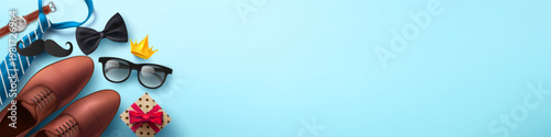 Happy Father's Day background with necktie,glasses and gift box for dad on light blue.Greetings and presents for Father's Day in flat lay styling.Promotion and shopping template for love dad concept