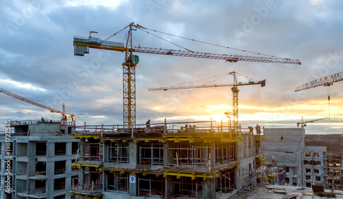 Bild auf Leinwand Sunset casts warm glow over construction site