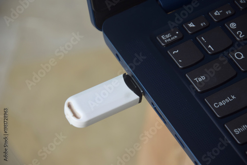 Flash drive is connected to the laptop via the USB port	