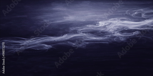 A smiling young woman in a yellow raincoat stands in a lush green forest holding a transparent umbrella during a gentle spring rain shower