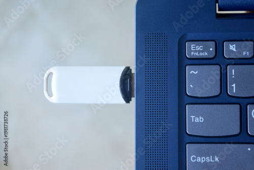 Flash drive is connected to the laptop via the USB port	