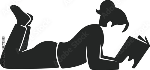 Person relaxing and reading a book in a comfortable position on the floor