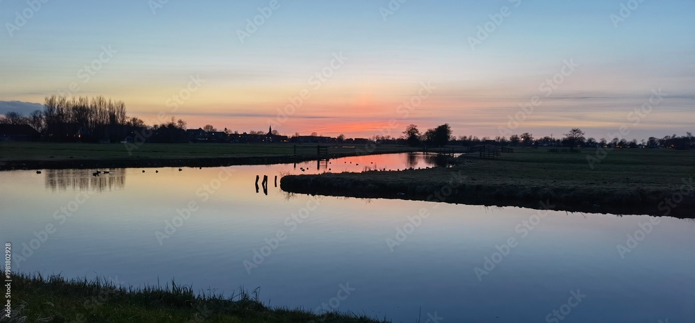 Fototapeta premium sunset over the river