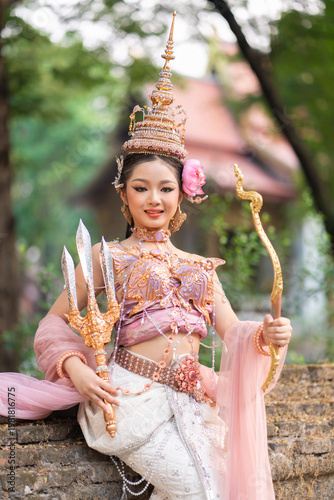 Songkran goddesses and queens celebrate with traditional attire and joyful spirit during Songkran festival in beautiful outdoor setting