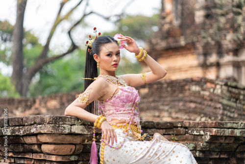 Songkran goddesses and queens celebrate tradition with elegance and grace during Songkran festival in ancient temple setting