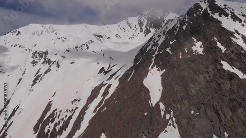 Caucasus, North Ossetia. Adaykom Gorge. Rocky, snow-capped mountains.