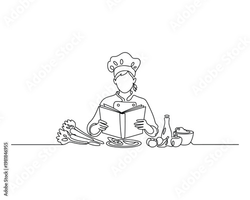 Chef in uniform reading a recipe book surrounded by fresh ingredients and kitchenware