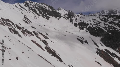 Caucasus, North Ossetia. Adaykom Gorge. Snow-capped mountain slopes.