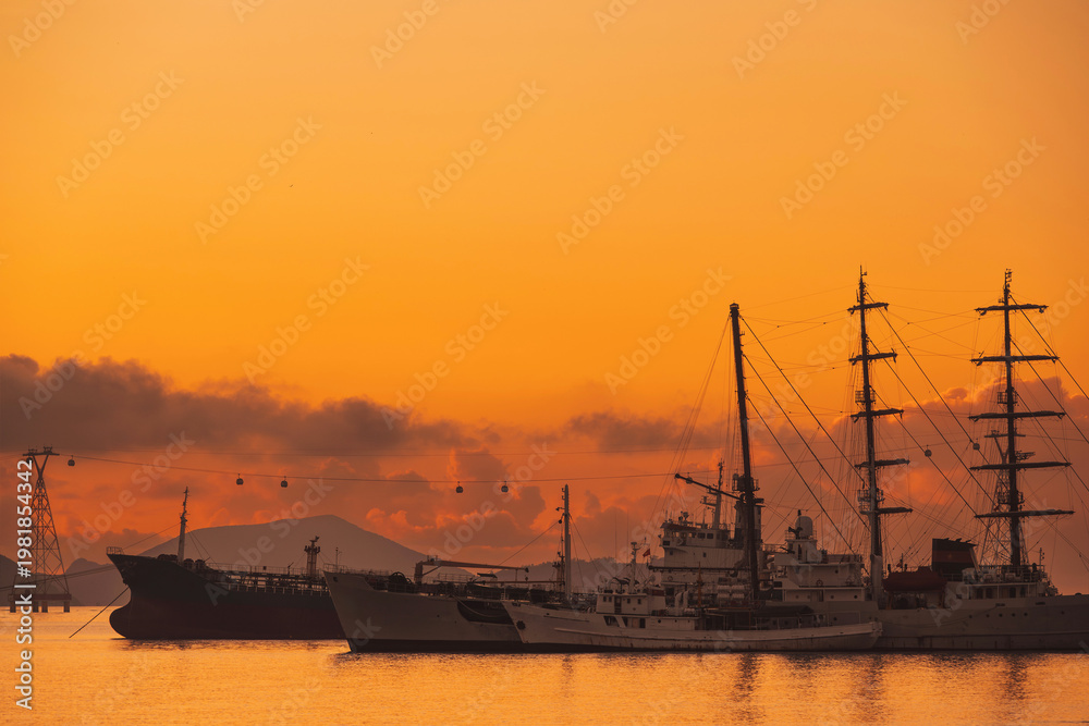 Obraz premium Vietnamese warships military ships in a port at sea in morning at dawn in harbor in Nha Trang in Vietnam