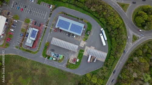 Drone shot of a commercial petrol station forecourt and road infrastructure during high fuel demand in the UK