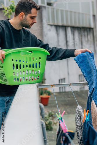 man hanging laundry on the clothesline