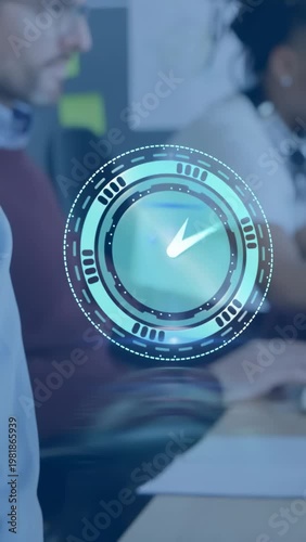 Diverse team typing on keyboards holographic clock HUD hovering at office desks in burgundy sweater