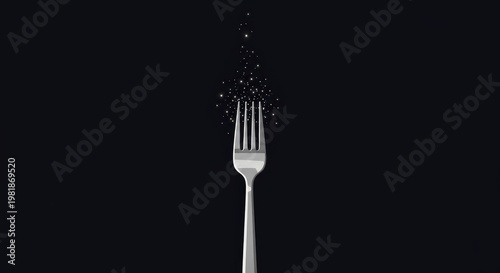 Silver fork with abstract floating particles on dark background