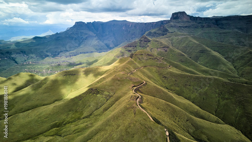 Aerial View Winding Mountain Ridge South Africa, Meandering Trail Slicing Through Emerald Grassland, Steep