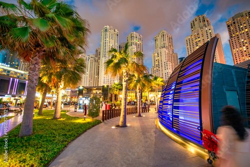 Bild auf Leinwand Panoramic Dubai Marina at night showcasing high-rise buildings, beach promenade,