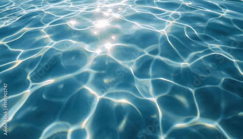 Sunlight refracting on rippling blue water surface with sunlight refraction abstract background refreshing reflection movement underwater