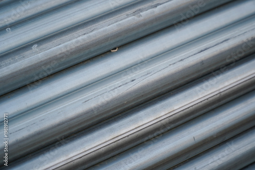 Stacked Galvanized Metal Pipes Close up with Industrial Surface Texture