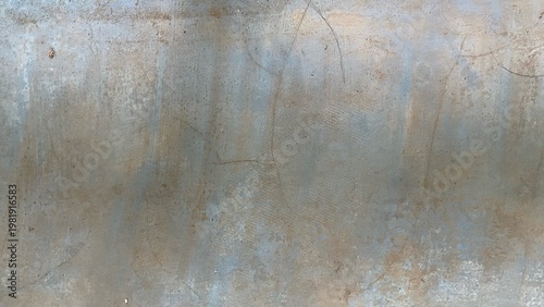 The texture of a concrete wall surface, with its stains, scratches, and faded colors, creates an aged and industrial feel. It's suitable as a backdrop or design element for grunge and urban themes.