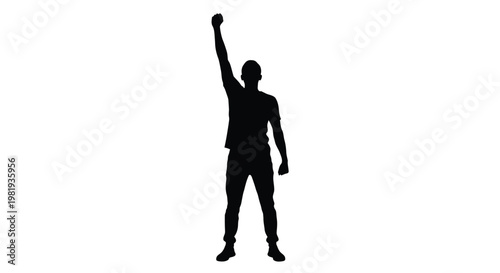 Silhouette of a man standing tall with his arm raised in a gesture of power and victory