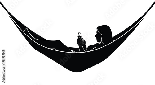 Silhouette of a young woman relaxing in a hammock while using her smartphone for social media updates