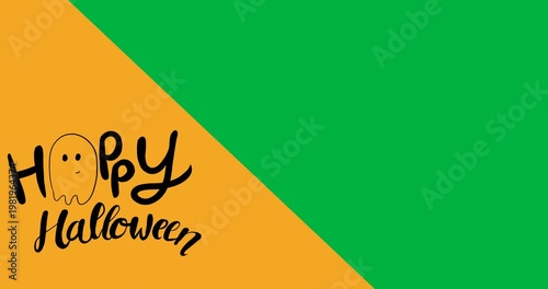 Digital animation of happy halloween text banner against yellow and black dual tone background