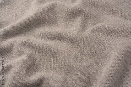 Soft grey merino wool sweater texture as a background.