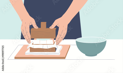 A person pressing tofu using a mold on a table.