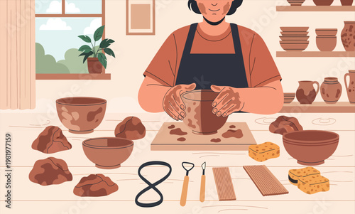 A person shaping clay into pottery by hand in a workshop