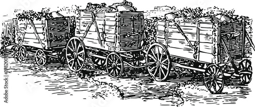 Three wooden wagons loaded with crates ready for transport in vintage rustic