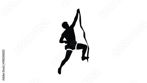 Silhouette of a man rock climbing.