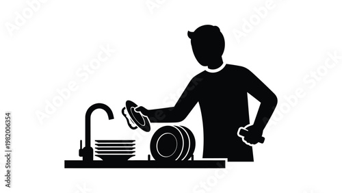 Man washing dishes in the kitchen.