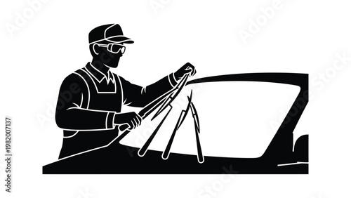 Mechanic replacing car windshield with tools.