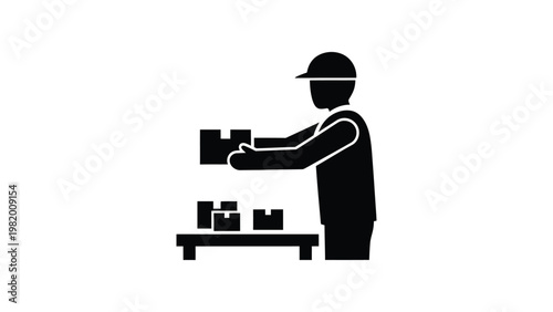 Worker in a warehouse handling boxes.