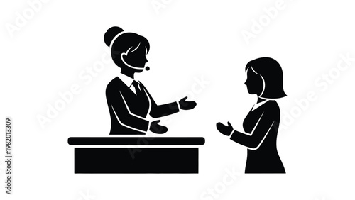 Two women communicating in a meeting.