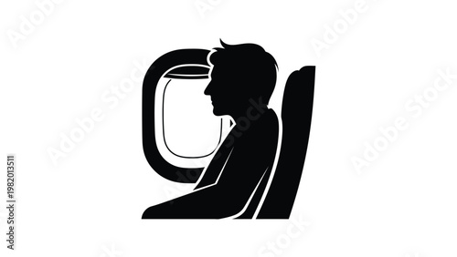 Silhouette of a man looking out airplane window.