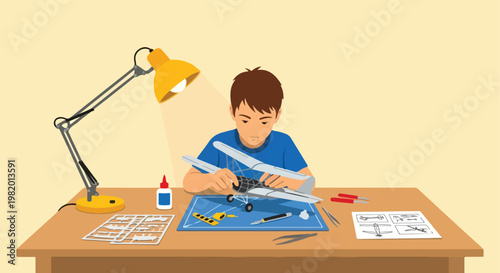 A focused young boy assembling a scale model airplane under a bright desk lamp