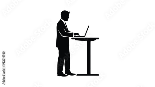 Businessman working on laptop computer standing.