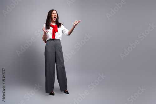 Slika na platnu Angry businesswoman shouting in studio — frustrated professional woman expressin