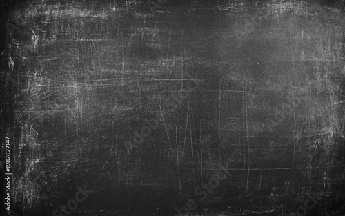 Black chalk board texture background. Chalkboard, blackboard, school board surface with scratches and chalk. Chalk rubbed out on blackboard background grunge texture