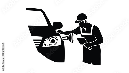 Mechanic inspecting car headlight with tool.