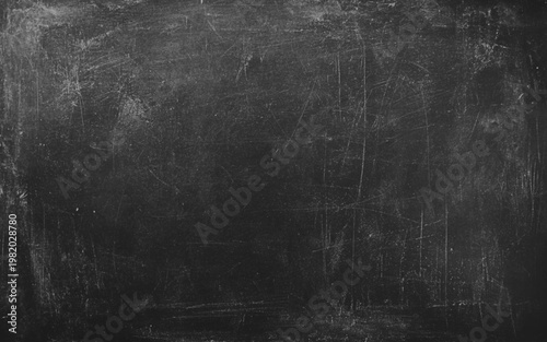 Blackboard background. Empty black chalkboard texture with scratches and wet chalk traces. Chalk rubbed out on blackboard background grunge texture