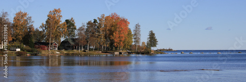 Colorful trees in autumn and Lake Vanern, Vita Sannar, Sweden.