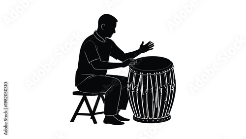 Man sitting and playing a drum.